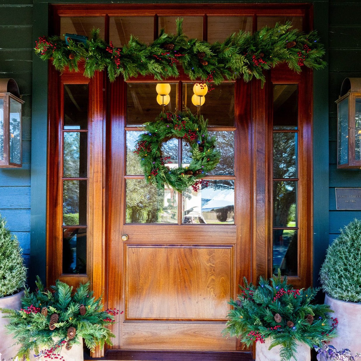 Battery operated garland on outdoor porch railing
