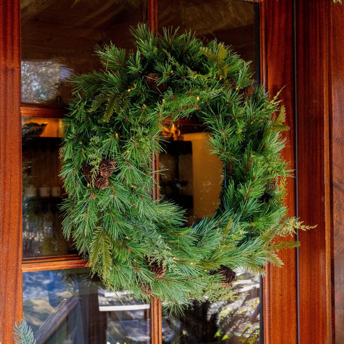 Low maintenance faux boxwood wreath on front door